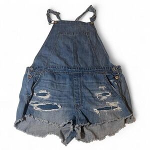 Woman's grunge ripped overalls